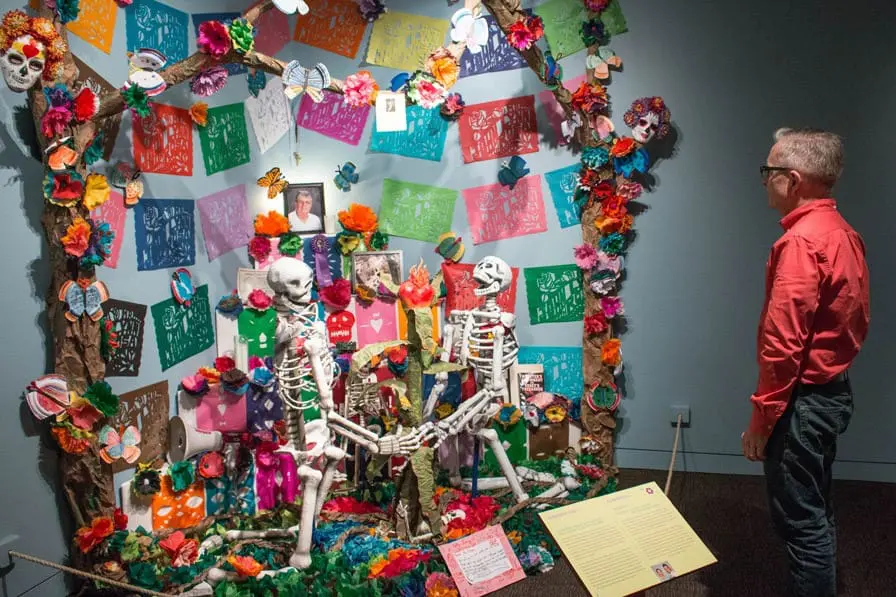 Jose Enrique Ortiz in collaboration with La Escuelita Elementary, Celebration of Life, 2013. In the exhibition The Tree of Life and Death: Días de los Muertos 2013, on view in the Gallery of California Natural Sciences at the Oakland Museum of California. Photo: Ace Lehner.