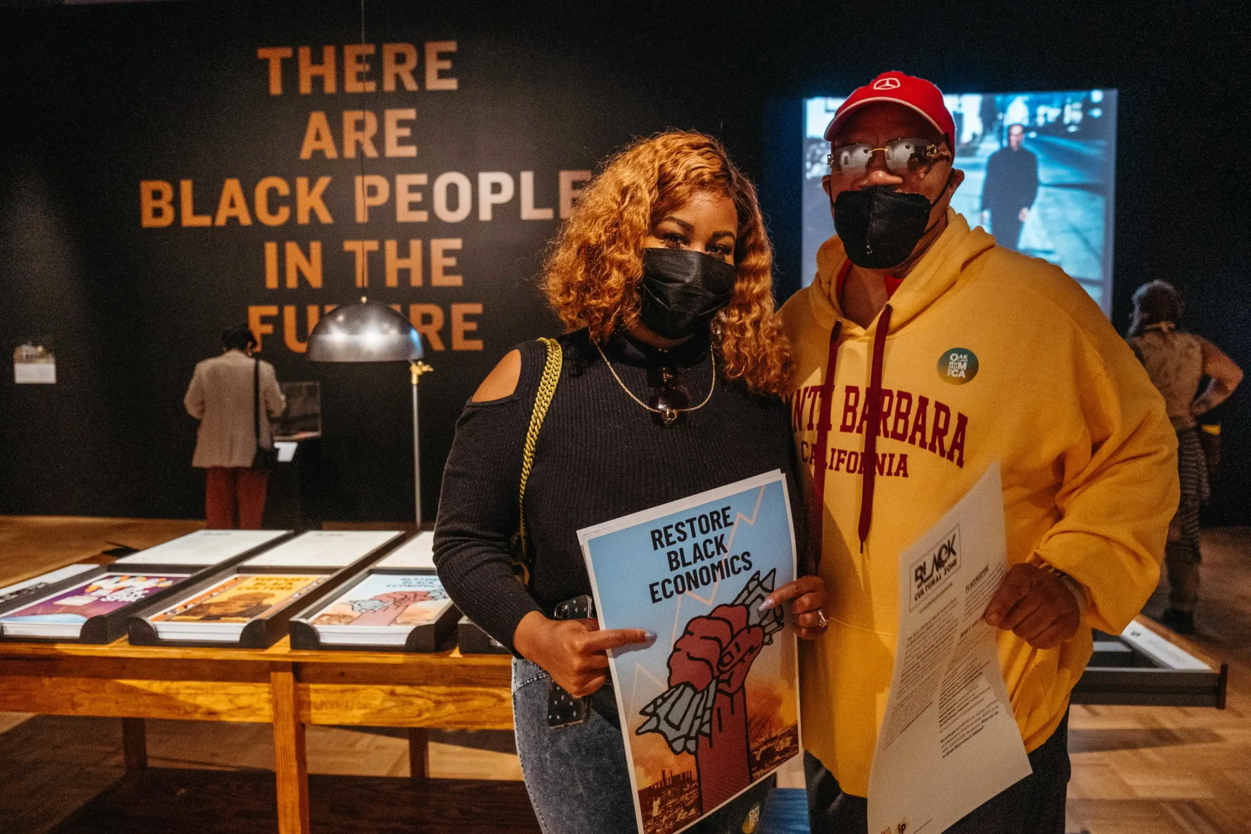 Two visitors pose for the camera inside the Great Hall