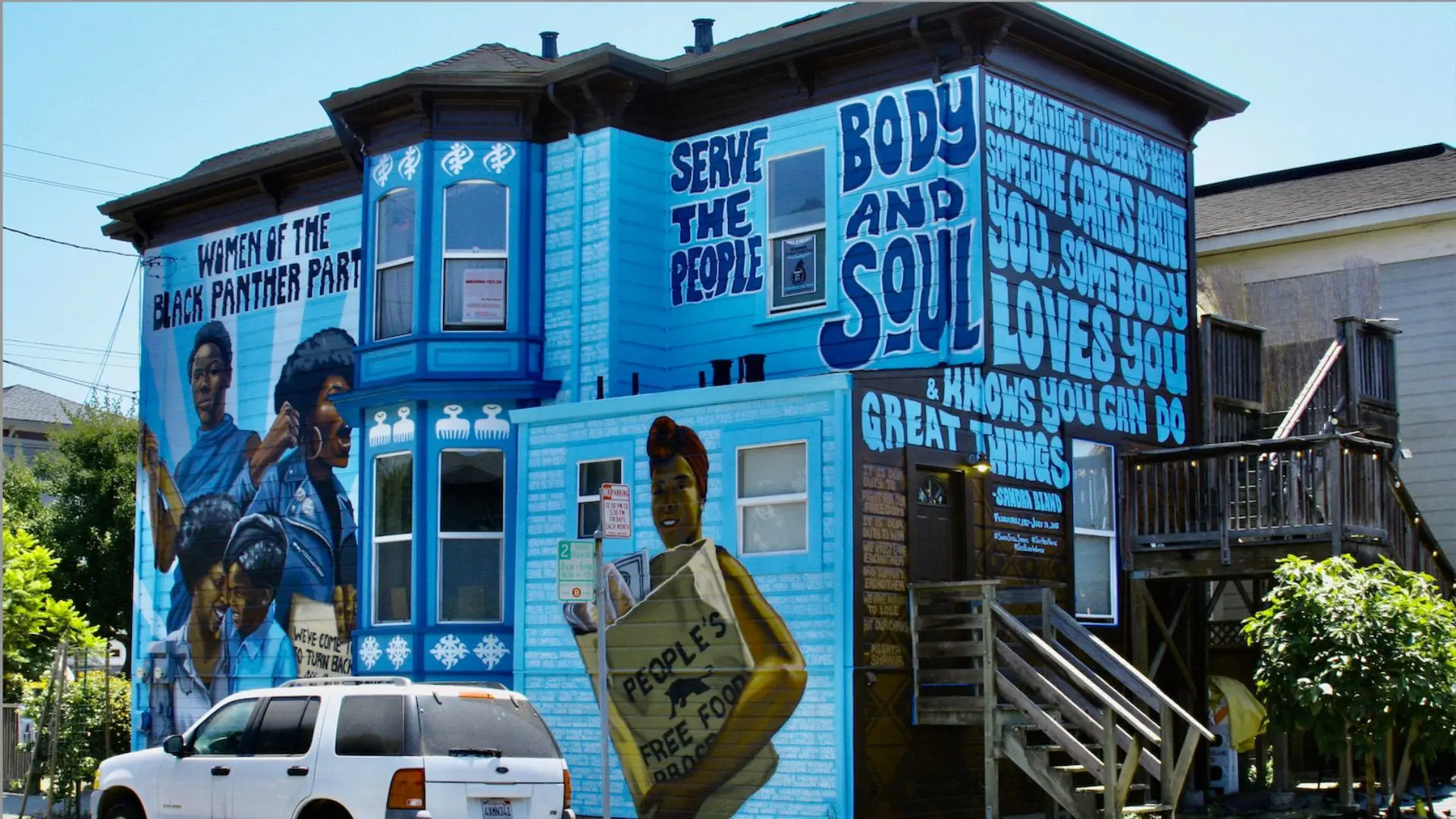 West Oakland Mural Project blue house with mural