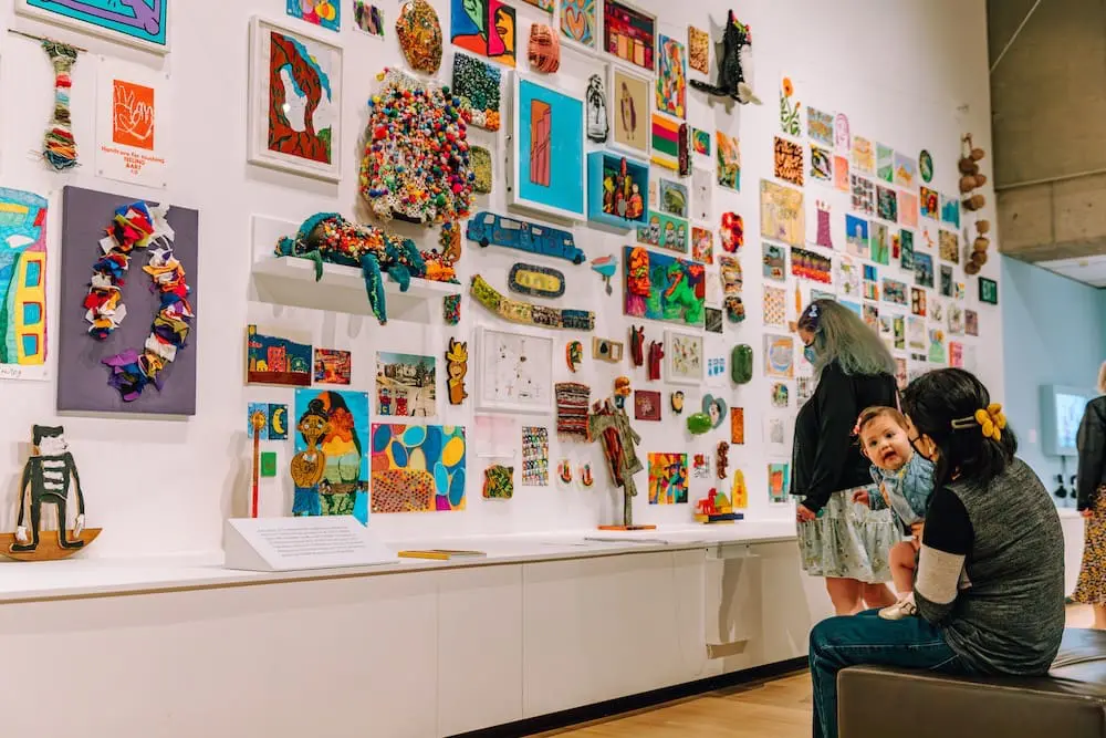 a family looking at art in Into the Brightness