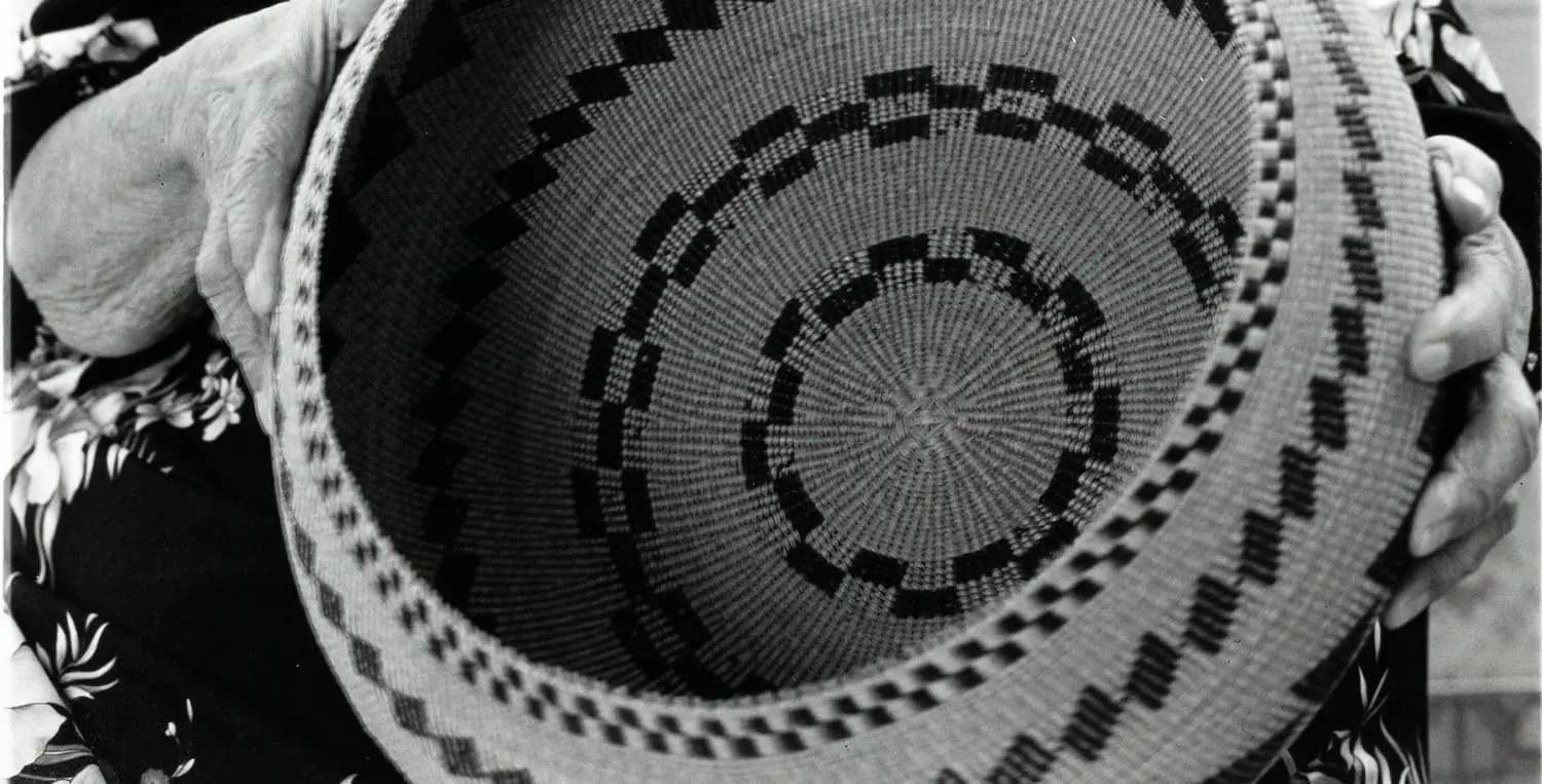 Dugan Aguilar, Elsie Allen (Pomo) Holding a Basket by her Mother, Annie Burke, Circa 1985, Oakland Museum of California,gift of the family of Dugan Aguilar.