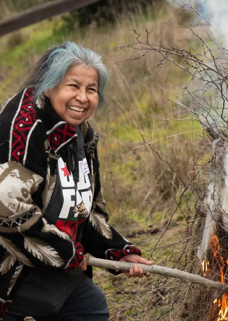 Diana Almendariz (Wintun, Nisenan, Hupa) burns basketry plants at the Cache Creek Nature Preserve.
Courtesy of Alysha Beck/UC Davis