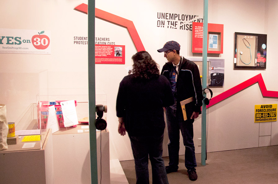 Visitors explore the interactive exhibit. Oakland Museum of California, 2013. Photo: Ryan LeBlanc.
