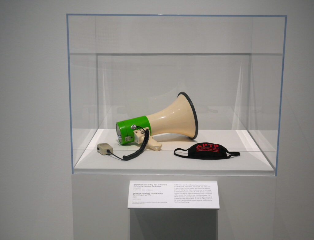 Megaphone used by Bay Area activist and Community Organizer Cat Brooks; Facemask created by The Anti Police Terror Project (APTP)