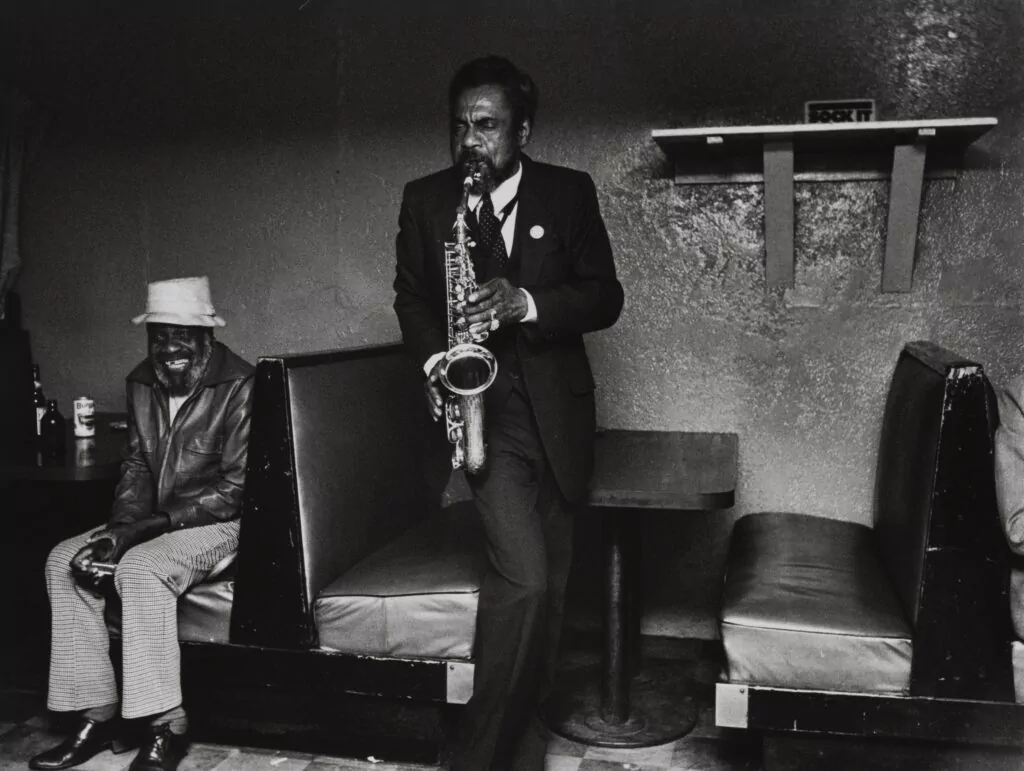 Michelle Vignes Kenny Playing Sax at the De Luxe Inn in Oakland 1983 Gelatin silver print OMCA